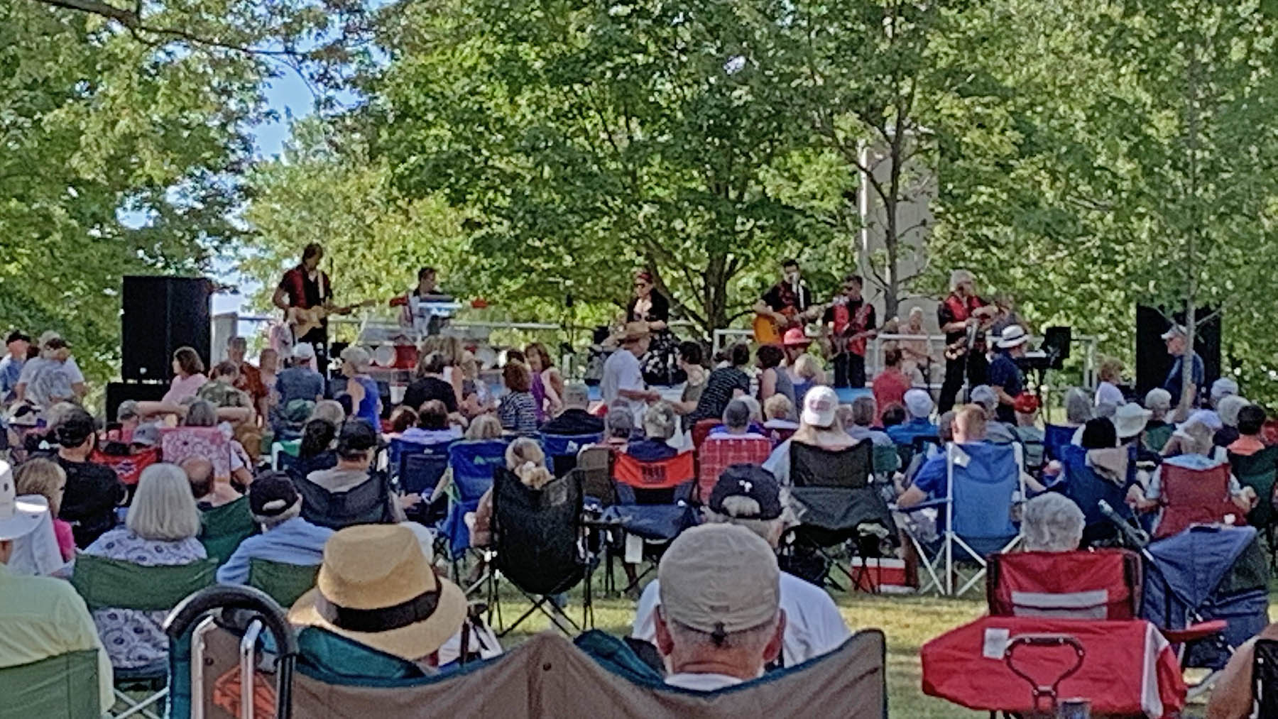 Photo of the band and audience from the 2022 performance by Ruby Shooz at the Sackets Harbor Battlefield