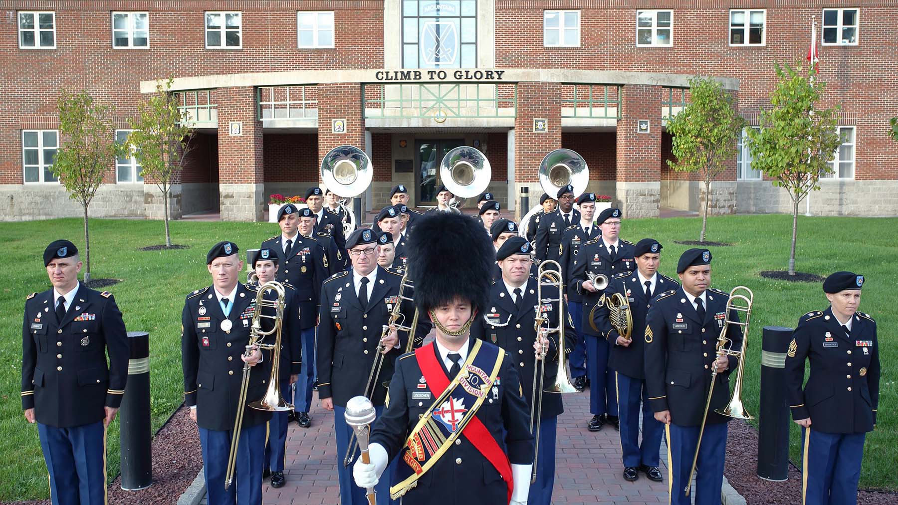 2022 publicity photo of the 10th Mountain Division Army Band in front of Hays Hall