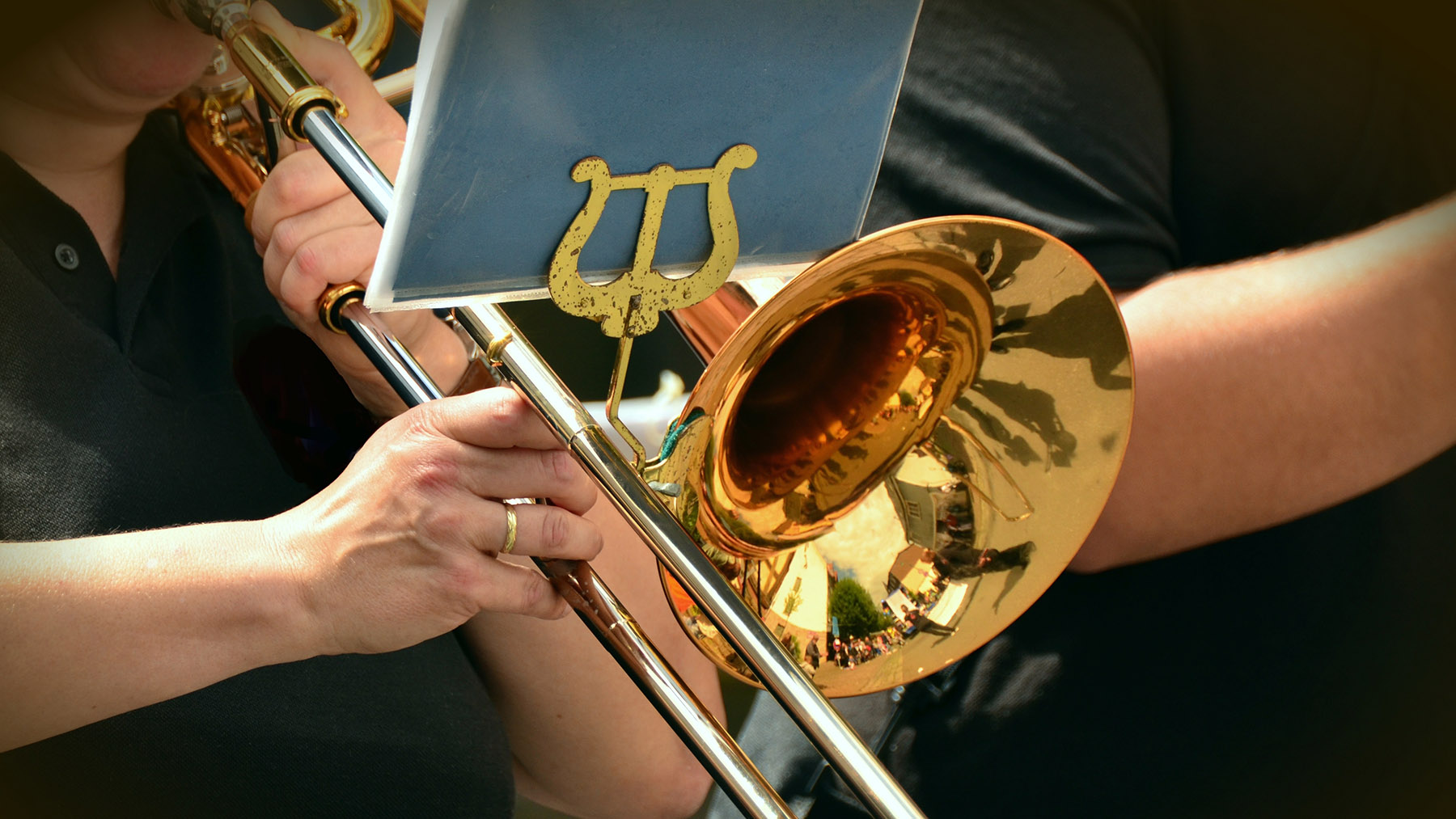 Stock photo of a musician playing the trombone (Image by RawPixel.com)