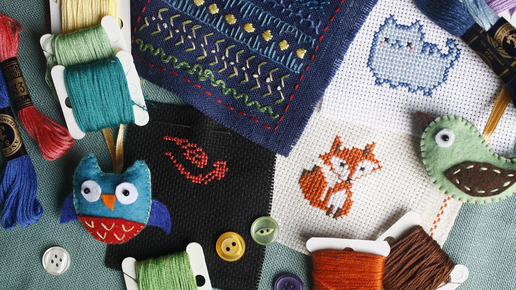 Various colorful cross stitch projects, threads, and buttons (Creative Commons image, courtesy of RawPixel.com)