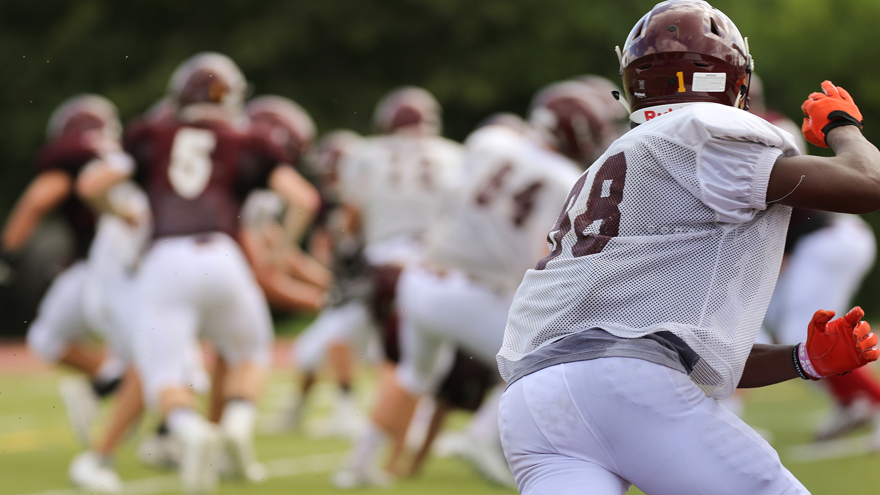 Stock photo of men playing a game of American football (Image by RawPixel.com)