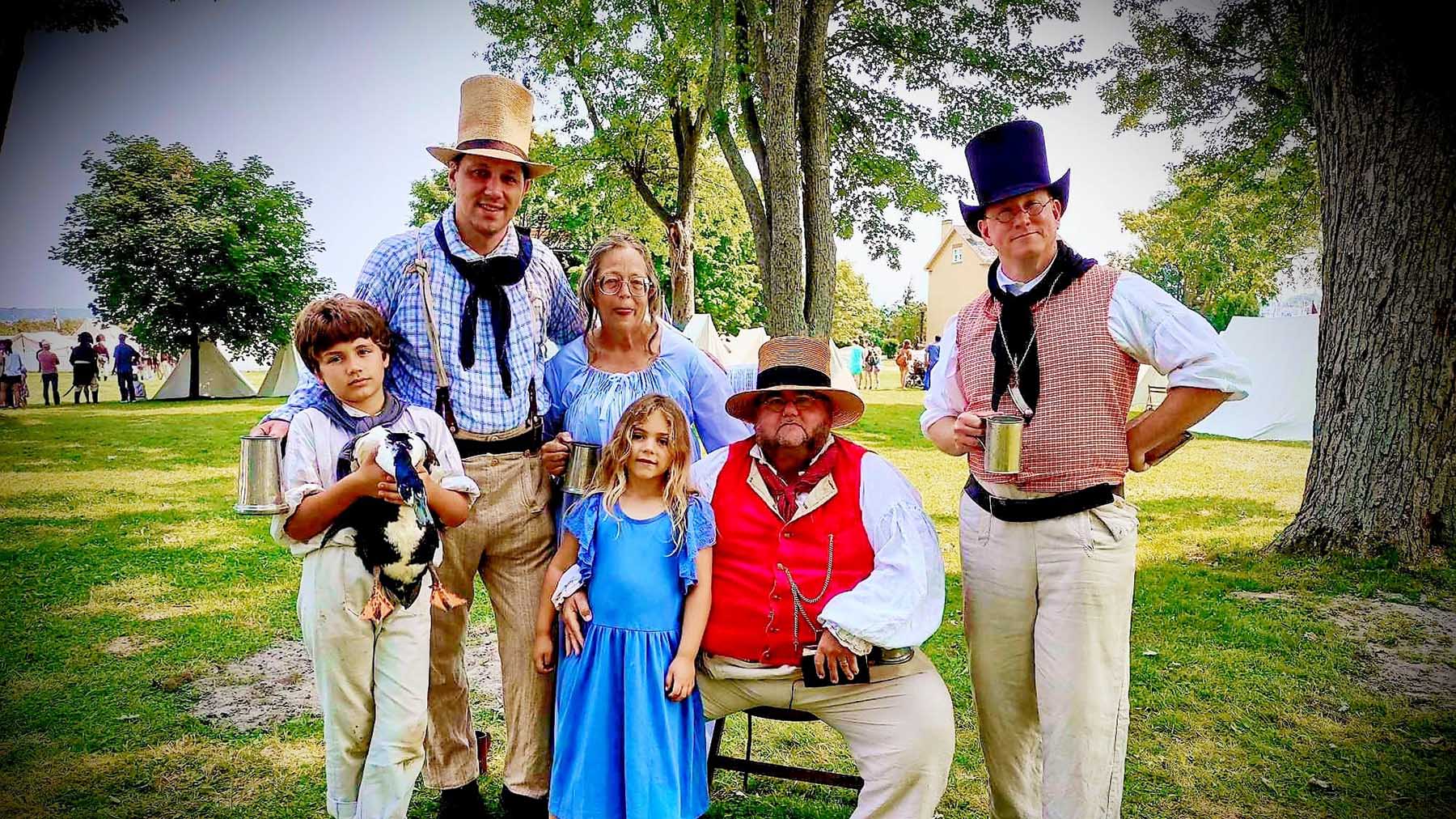 Color photo of the members of the musical group The Bosun's Call at the Sackets Harbor Battlefield State Historic Site in 2024